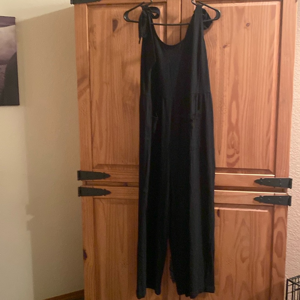 Small brand new romper with front pockets